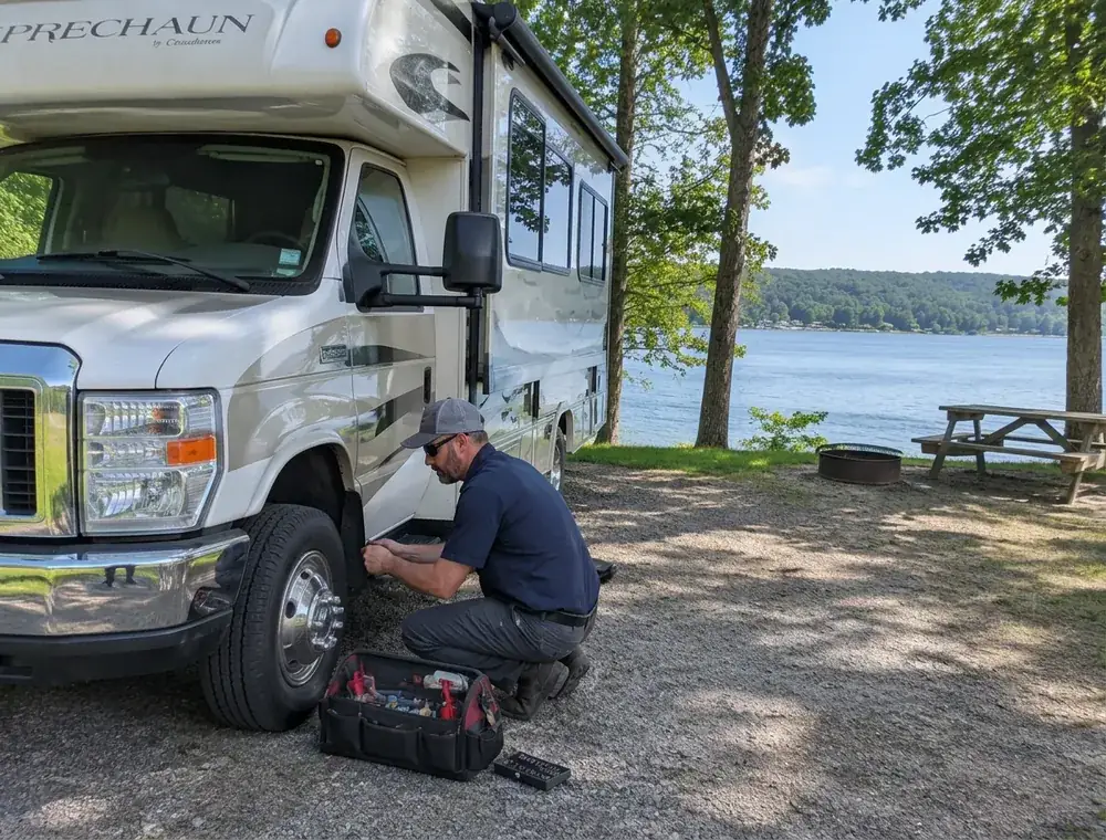 RV technician beside a Class C motorhome at a campsite near Smithville Lake in the Kansas City Northland